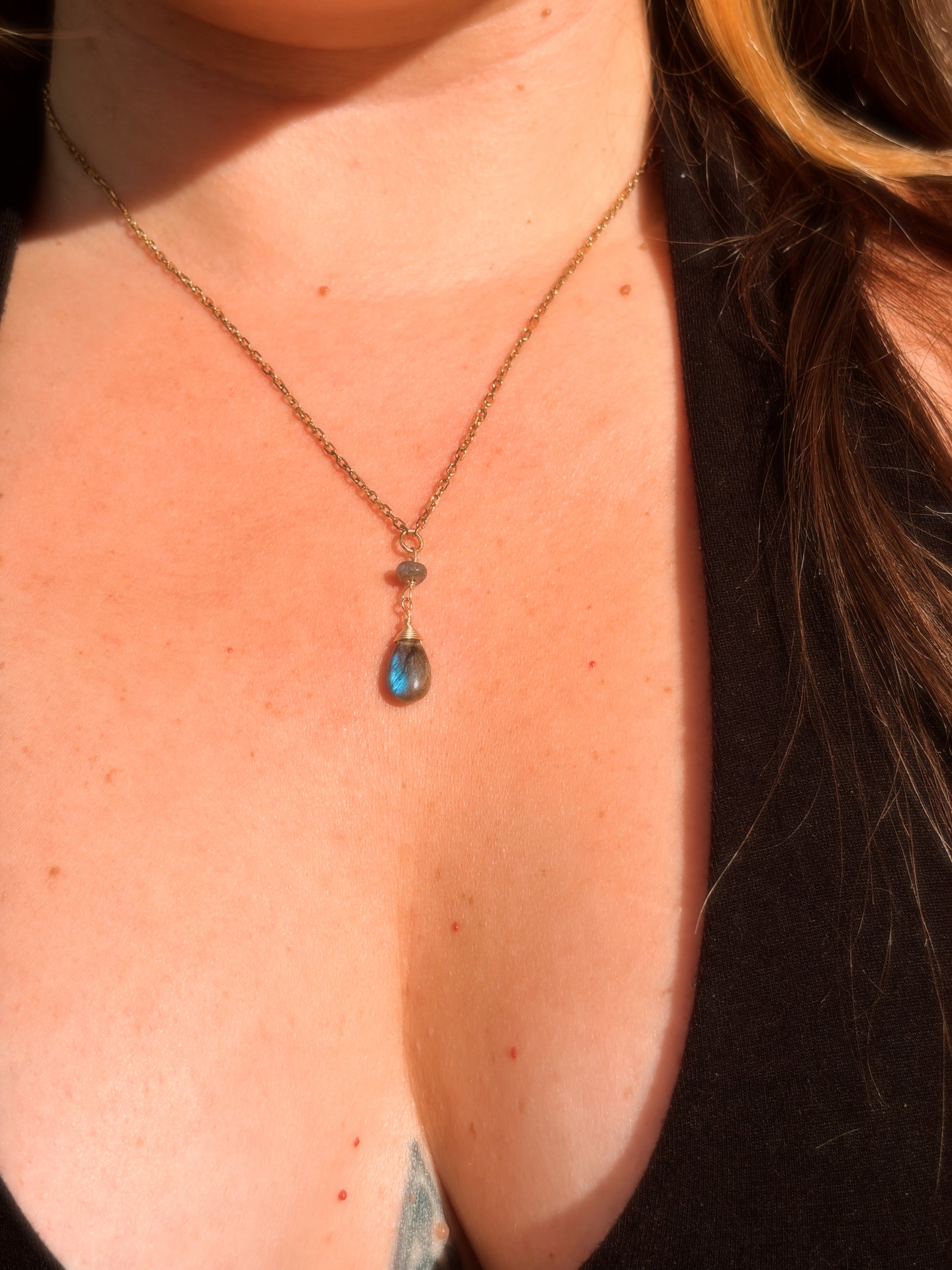 Stainless Steel Cable Chain Necklace with a double Labradorite pendant on a person's neck