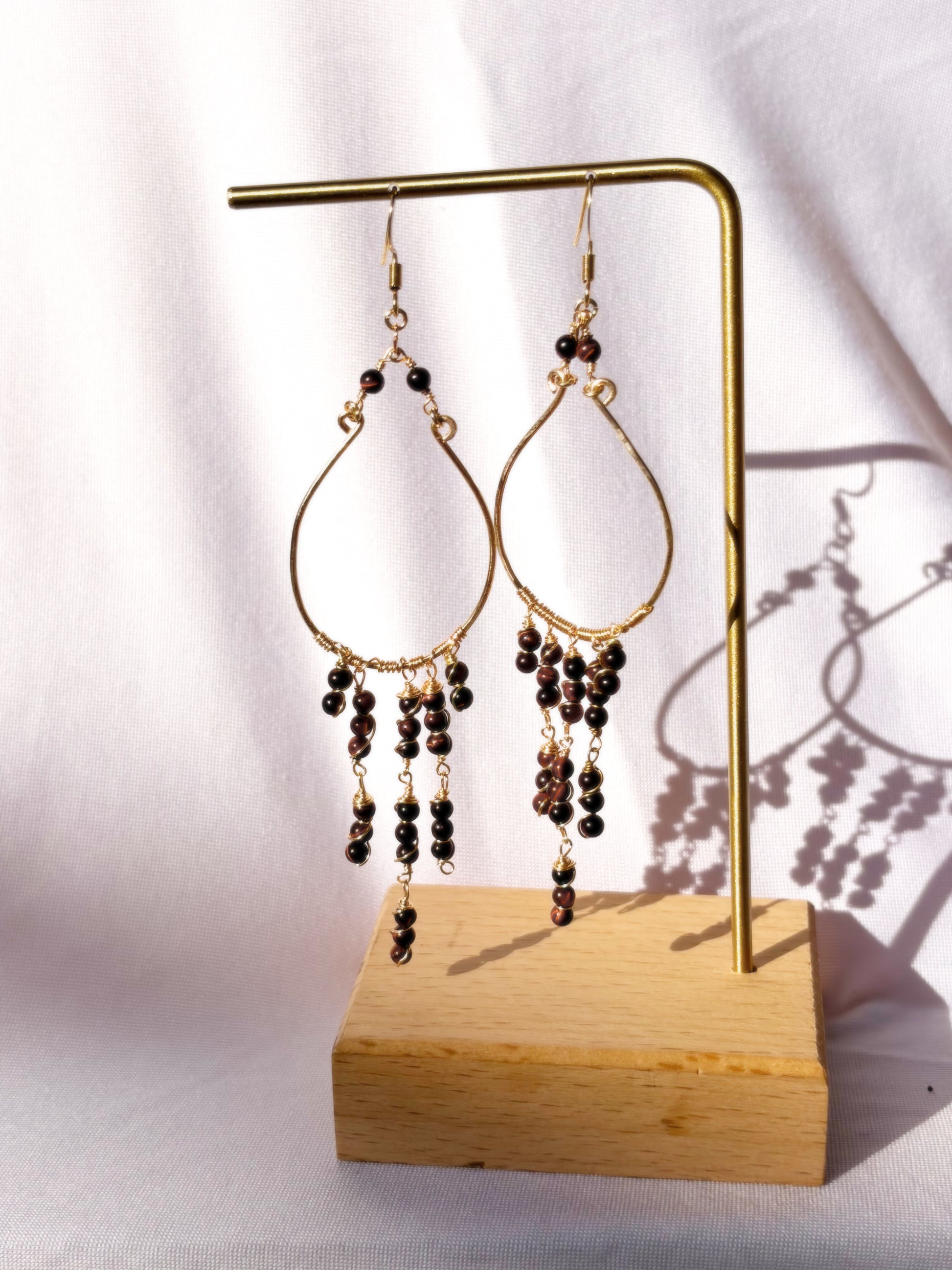 Red tiger eye gold fringe wire wrapped dangly earrings.