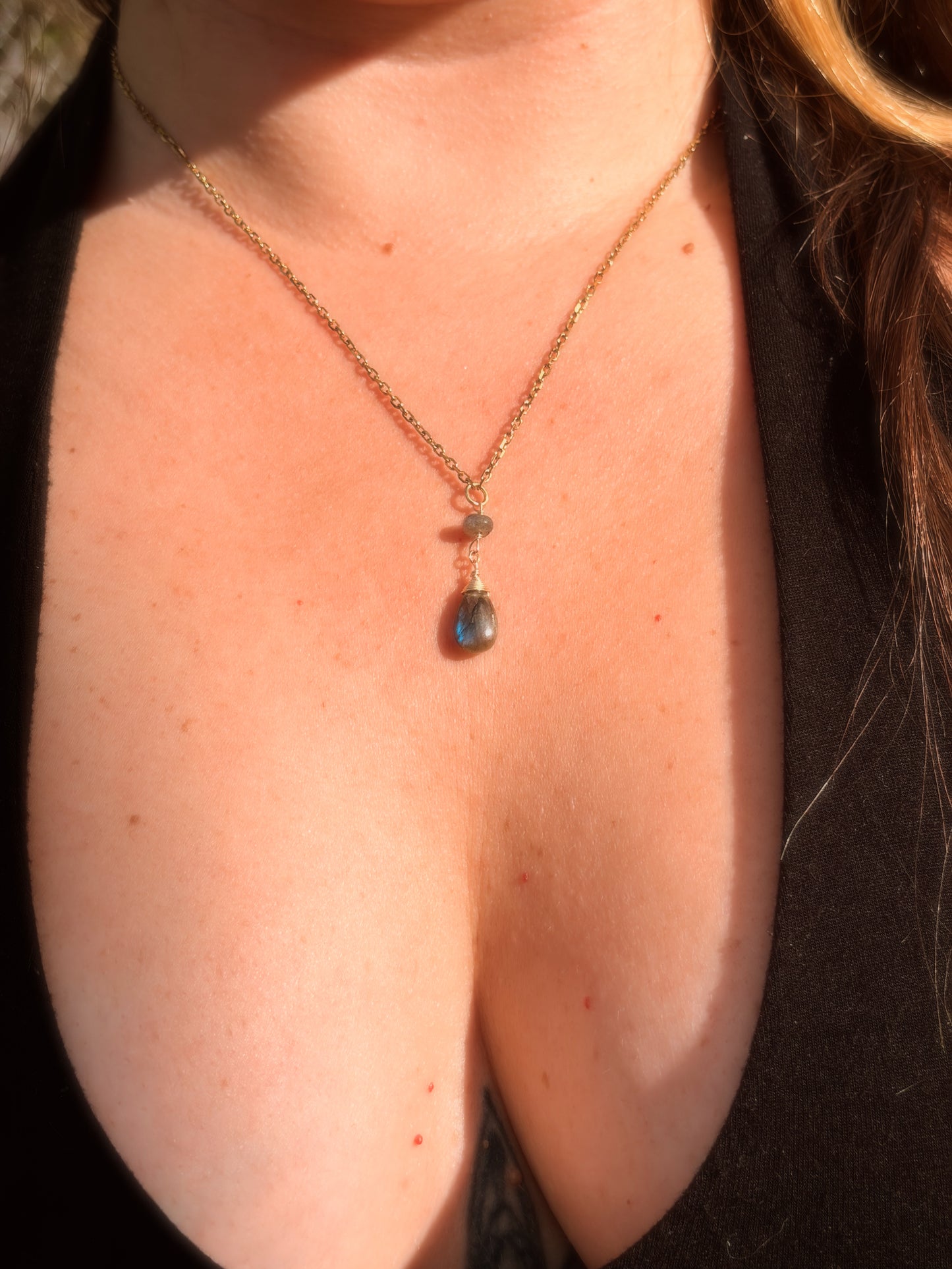 Stainless Steel Cable Chain Necklace with a double Labradorite pendant on a person's neck